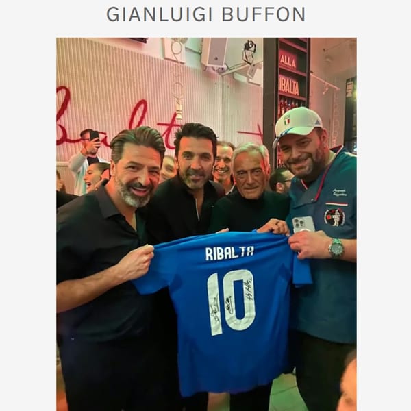 Four men, including Gianluigi Buffon, smiling and holding up a blue Ribalta soccer jersey.