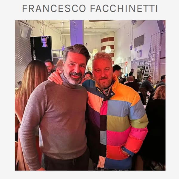 Two men, Francesco Facchinetti and a friend, smiling at a lively Ribalta Italian restaurant event.